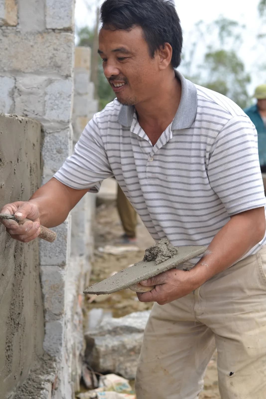 Construction worker carrying out installation work